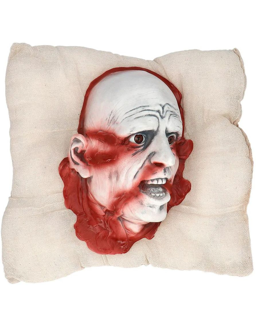 Avkappet Blodig Hode på Pute
